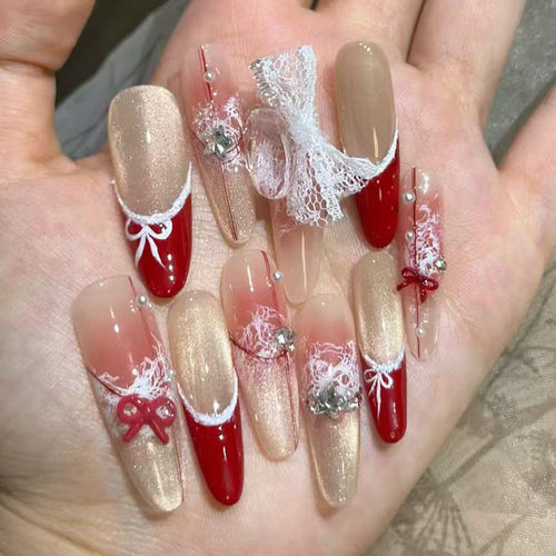 Artificial nails with romantic bow and lace design Bowlift
