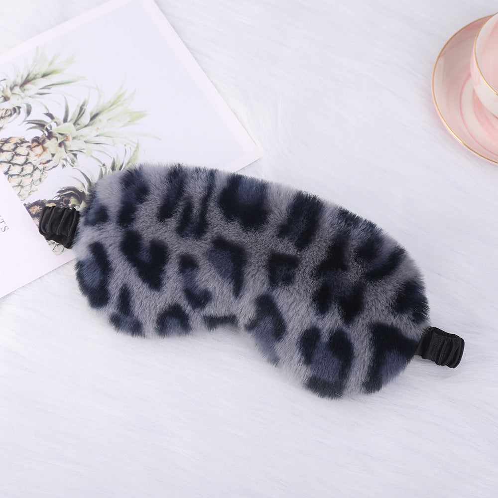 Women's cuddly faux fur sleep mask with heart-embossed surface and gathered comfort band Bowlift