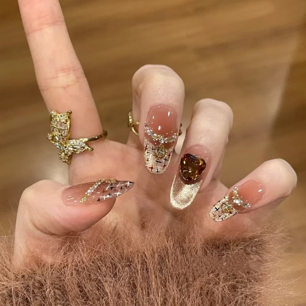 Artistic Press-On Nail Design with Gemstone Accents Bowlift
