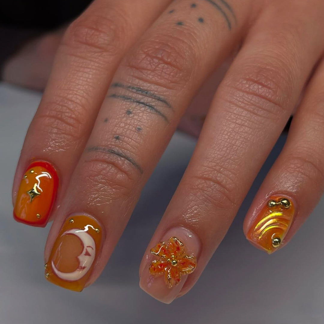 Artificial nails with floral motifs and glitter accents Bowlift