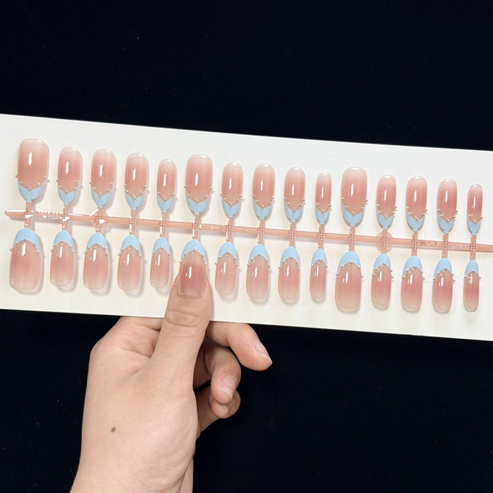 Artistic French Tip Nail Design with Glitter Accents Bowlift