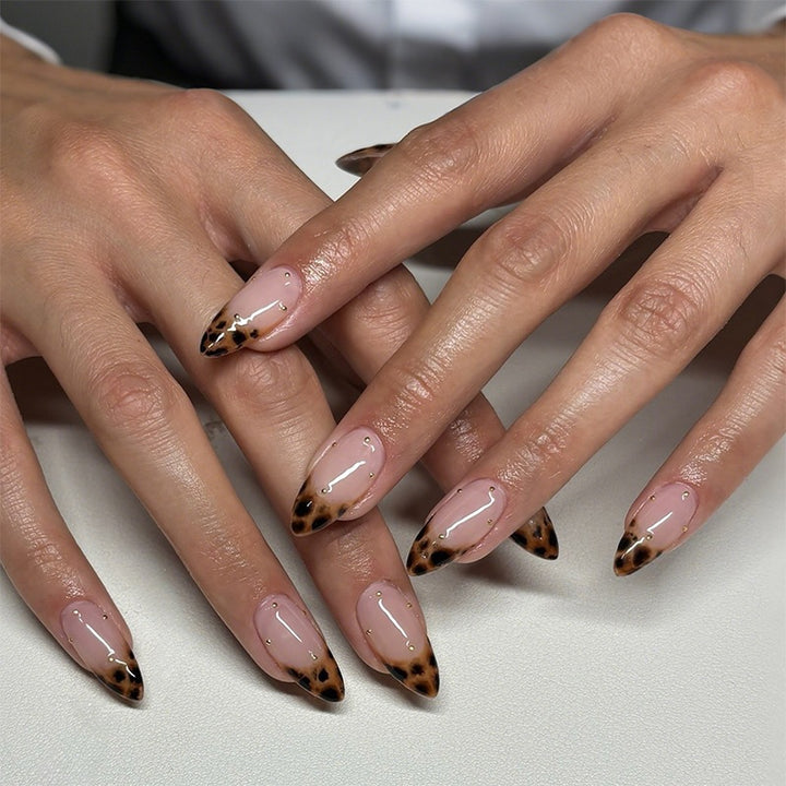 Acrylic nail set with elegant leopard design and gold accents Bowlift
