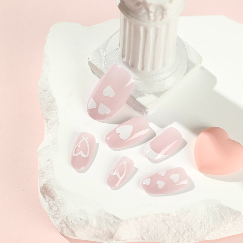 Elegant artificial nails with hearts and glitter Bowlift