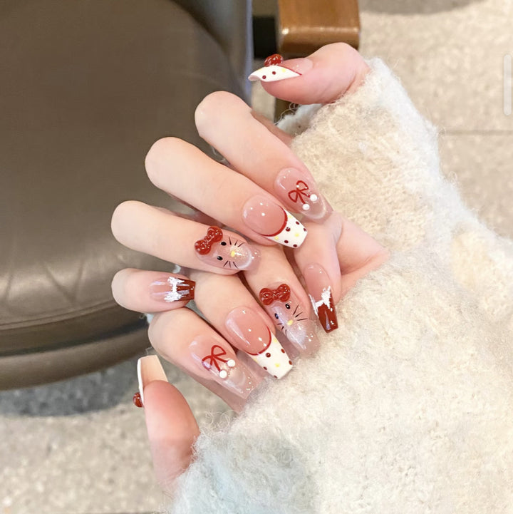 Artistic Press-On Nail Set with Whimsical Holiday Designs Bowlift