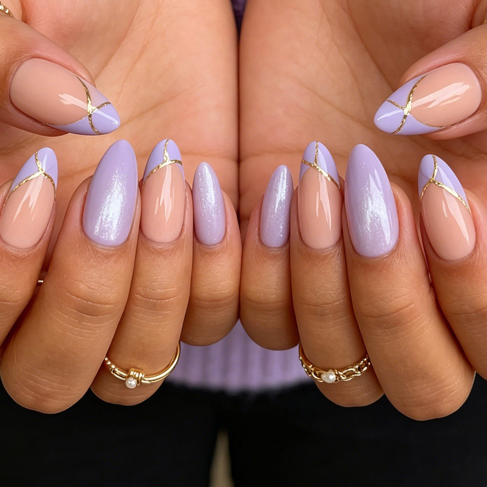 Stiletto Nail Art Tips with Gold Accents Bowlift