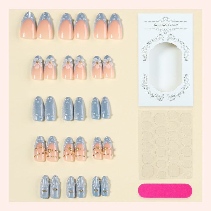 Artificial nail set with elegant flowers and glitter accents Bowlift