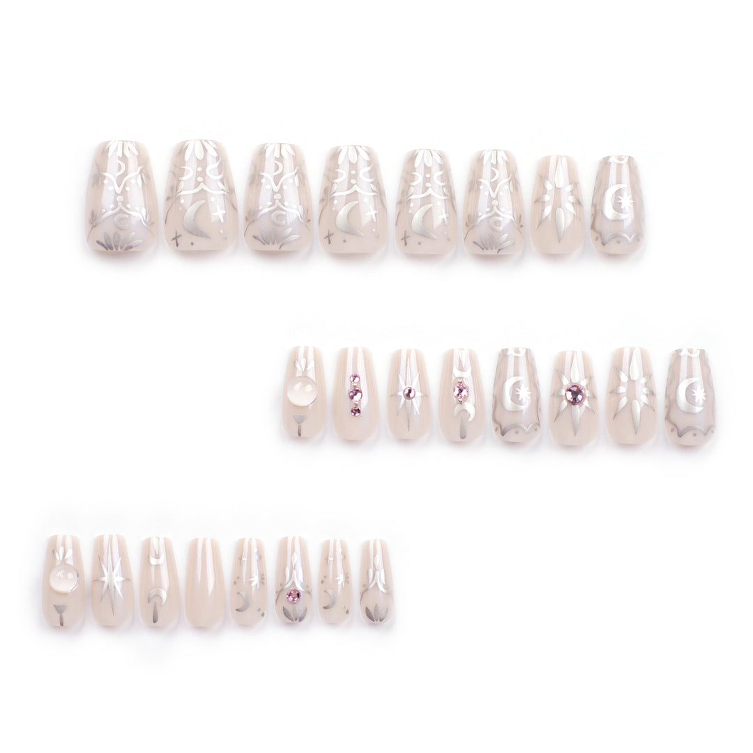Artificial nail art with elegant rhinestone and glitter effects Bowlift