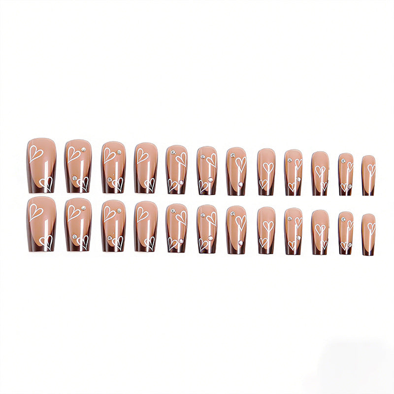 Elegant artificial nails with heart pattern and glitter accents Bowlift