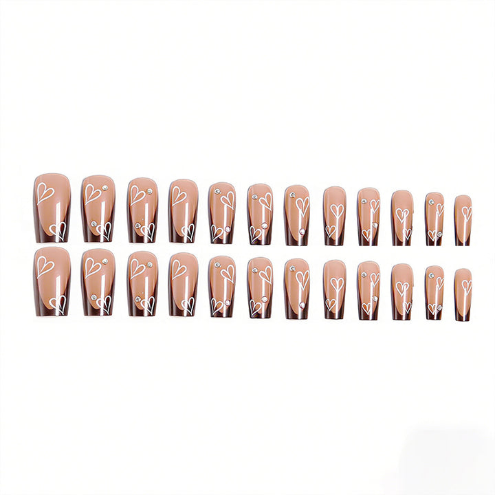 Elegant artificial nails with heart pattern and glitter accents Bowlift