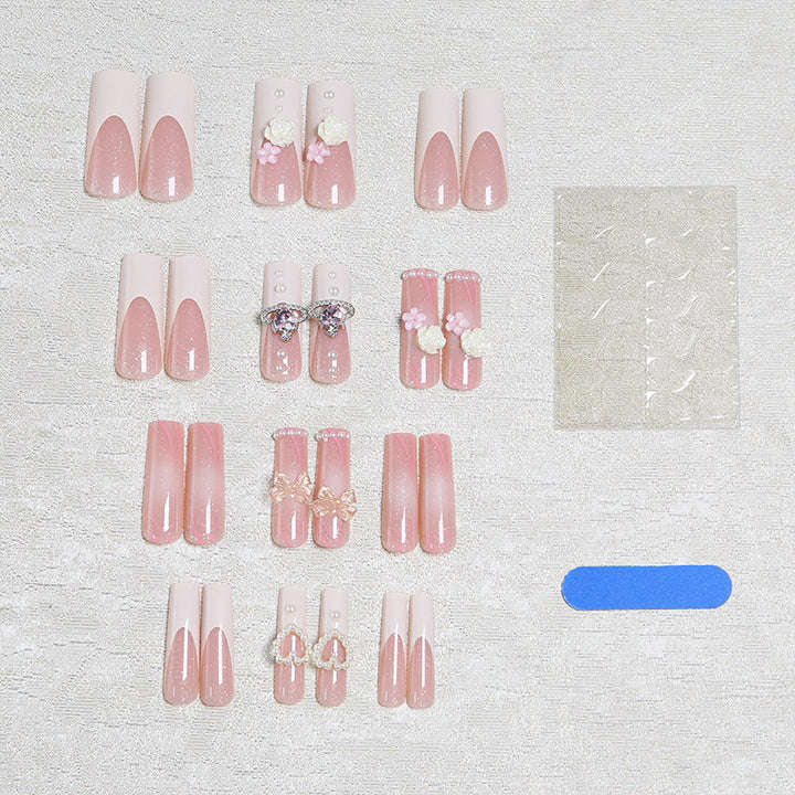 Artful nail tips with pearl and bow motifs Bowlift