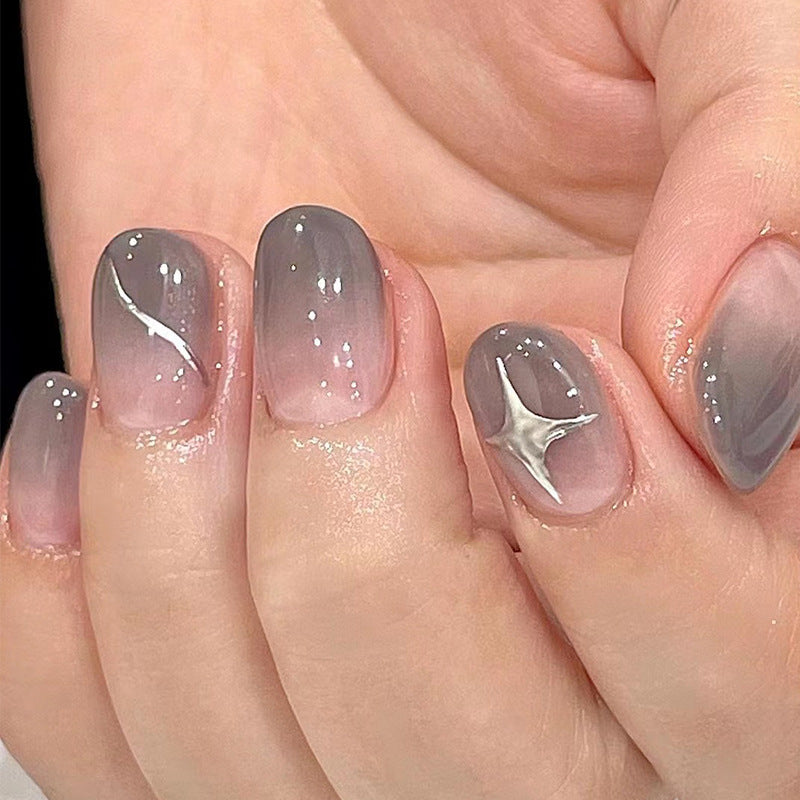 Artificial nail art with elegant ombre design and charming accents Bowlift