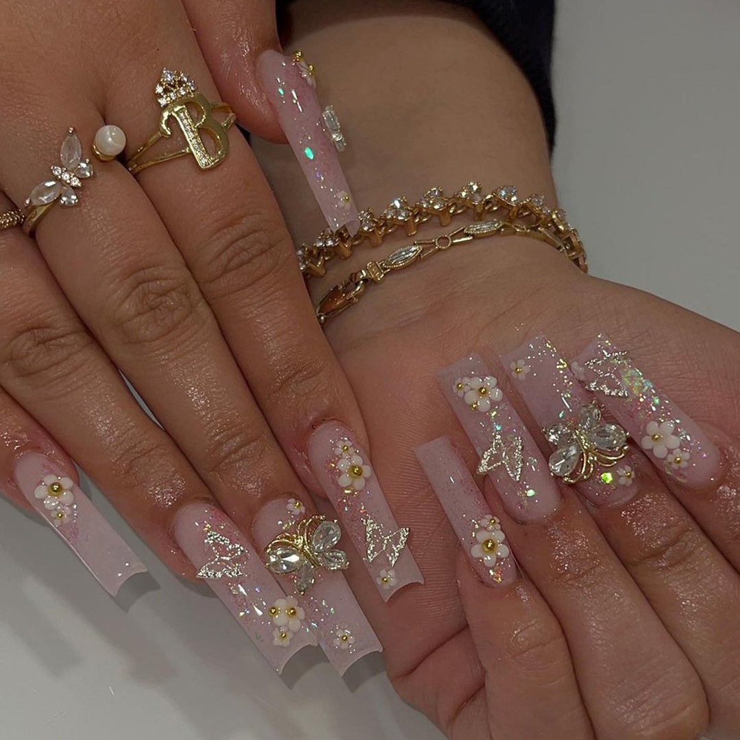 Artificial nail set with floral and glittering accents Bowlift