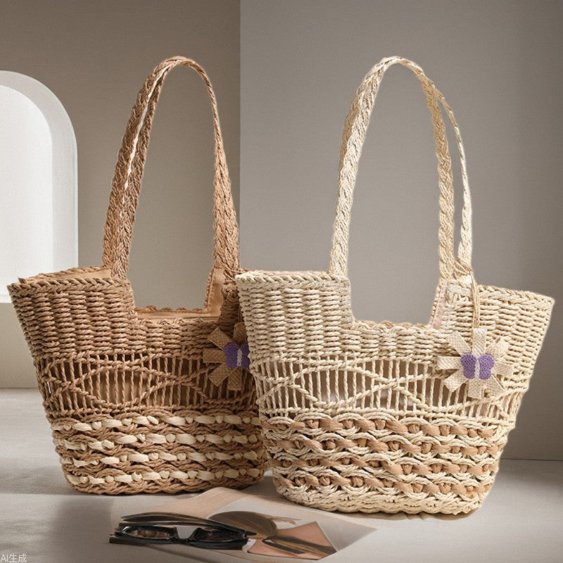 Braided basket bag with decorative flower appliqué Bowlift