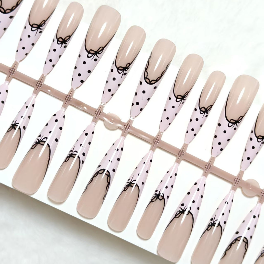 Elegant artificial nails with bow design and dots Bowlift