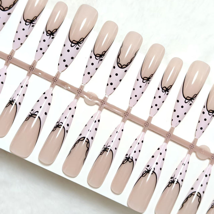 Elegant artificial nails with bow design and dots Bowlift