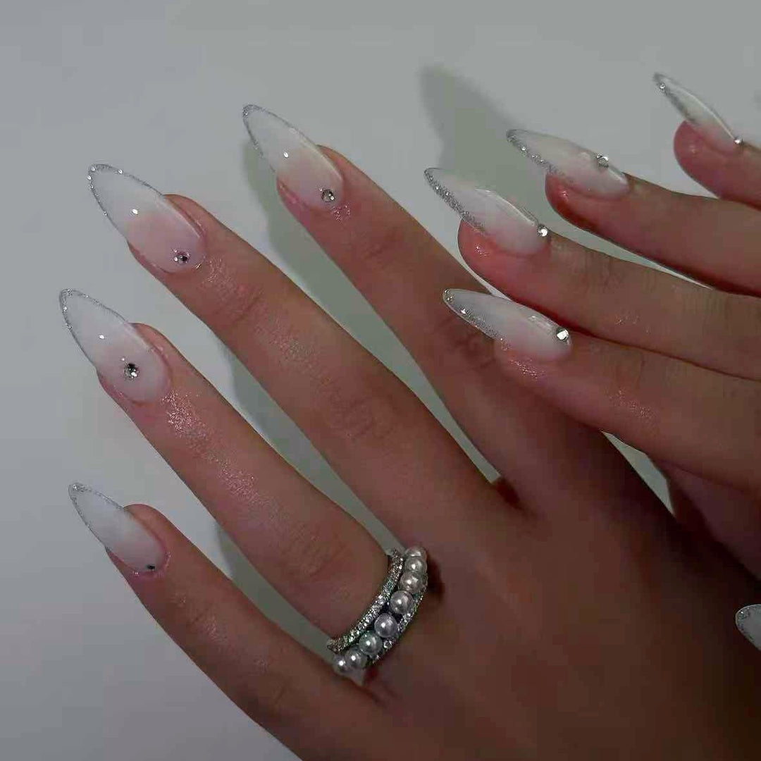 Acrylic nail set with elegant tips and sparkling accents Bowlift