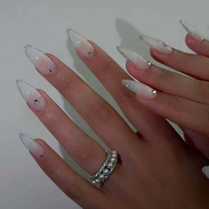 Acrylic nail set with elegant tips and sparkling accents Bowlift