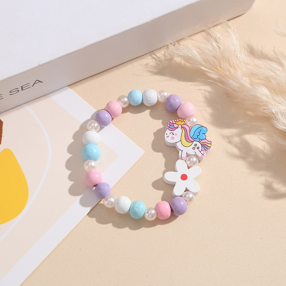 Playful children's bracelet with unicorn and flower motif Bowlift