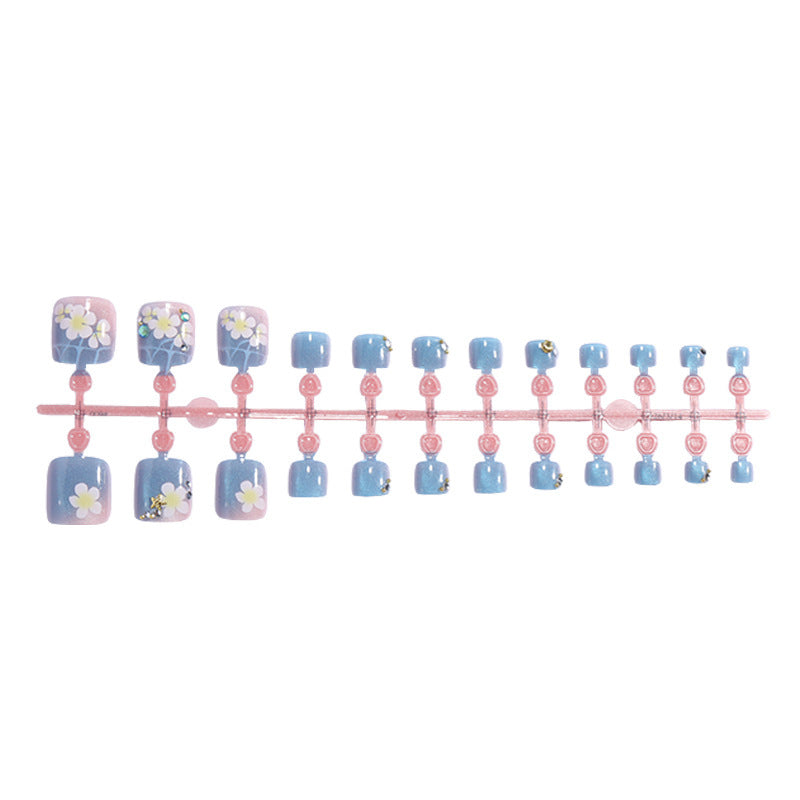 Artificial nail set with floral appliqués and glitter effects Bowlift
