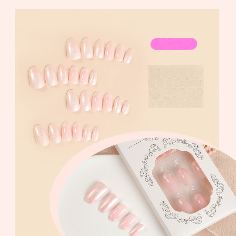 Artificial nail set with shimmering pearl and glittering accents Bowlift