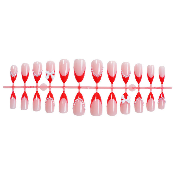 Elegant Press-On Nail Set with Pearl and Bow Accents Bowlift