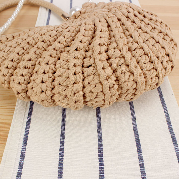 Evening bag with pearl decorated handle Bowlift