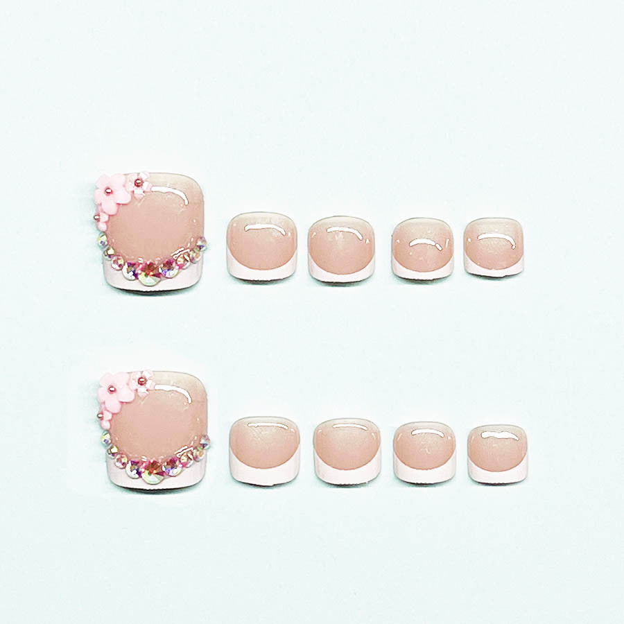 Elegant toenail art with delicate 3D floral decorations Bowlift