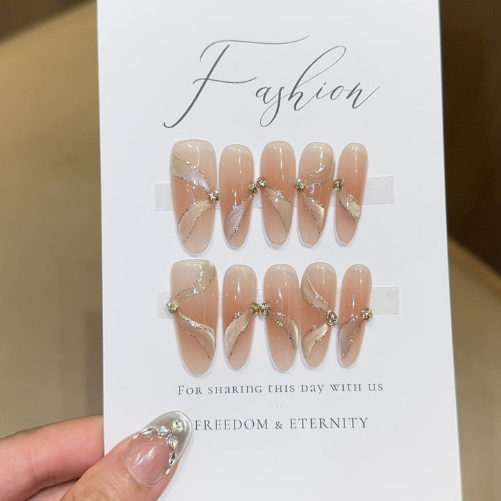 Artificial nails with elegant rhinestone accents Bowlift