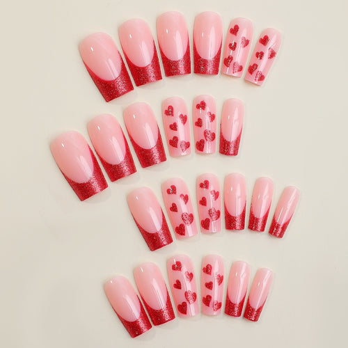 Acrylic nail set with glamorous heart designs and glitter accents Bowlift