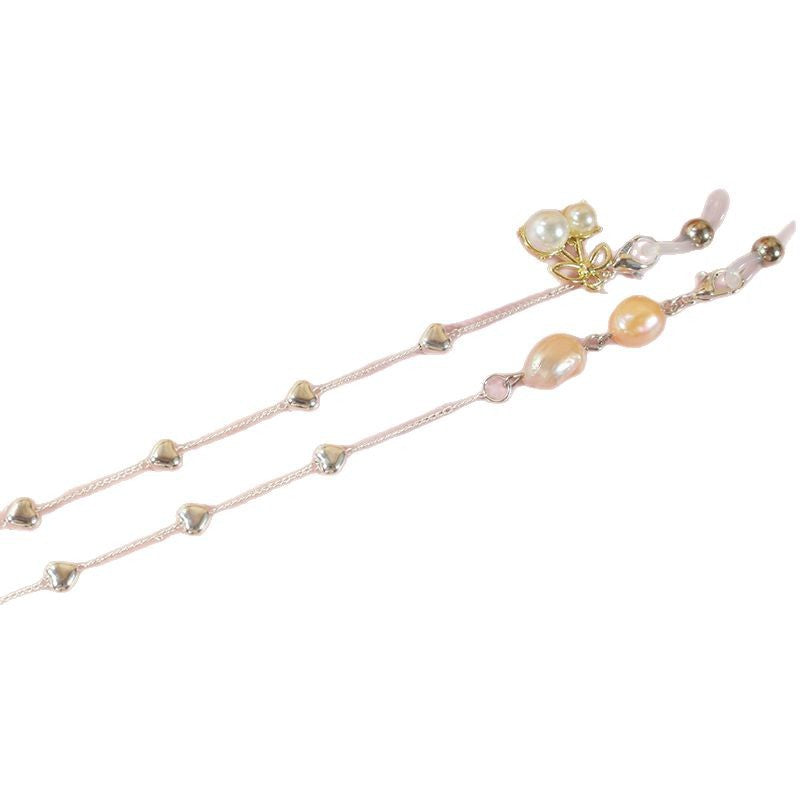 Elegant jewelry ribbon with pearls and silver accents Bowlift