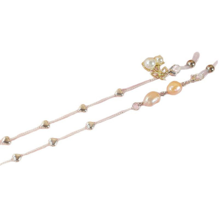 Elegant jewelry ribbon with pearls and silver accents Bowlift
