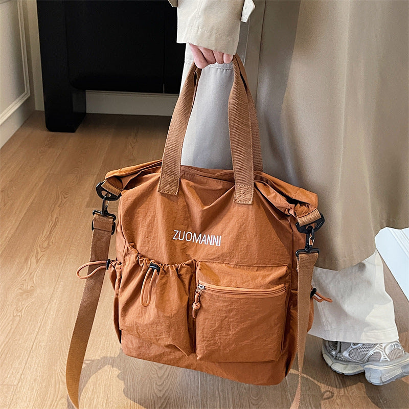 Tote bag with multifunctional outer pockets and adjustable shoulder strap Bowlift