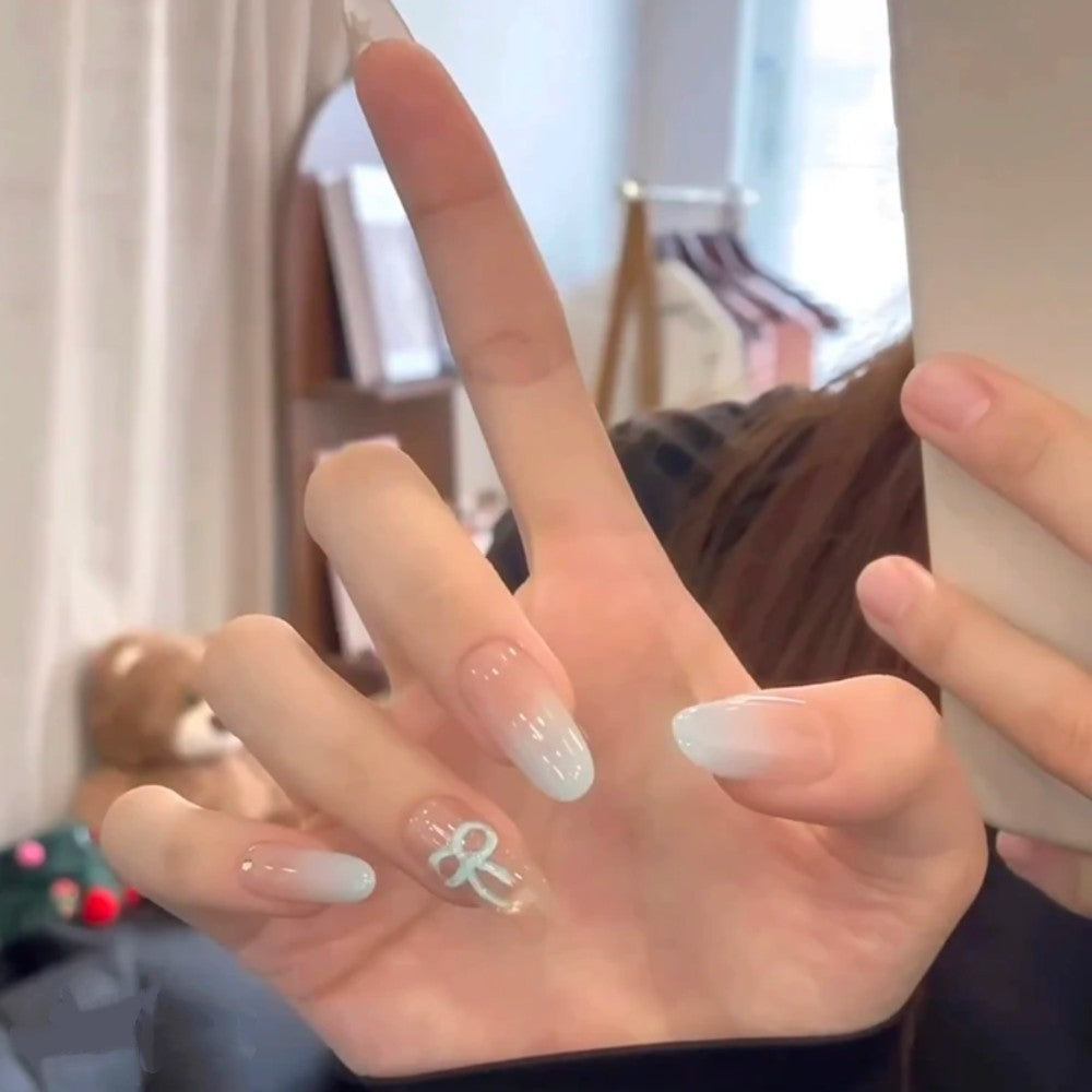 Artistic Press-On Nail Set with Glitter and Floral Accents Bowlift