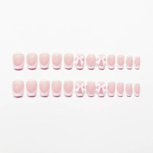 Artificial nails with elegant bows and pearl embellishments Bowlift