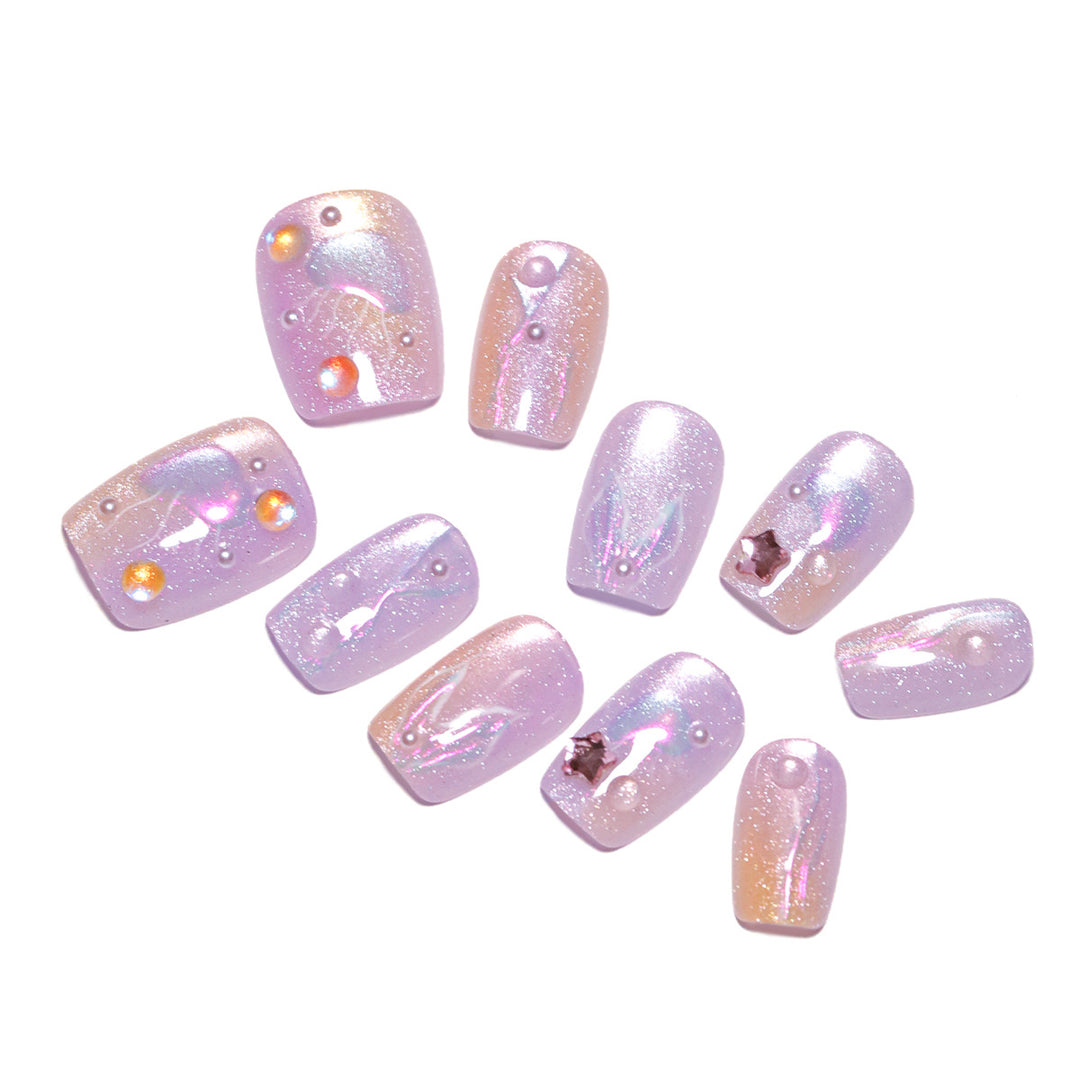 Artificial nail art with sparkling accents and transparent color gradient Bowlift