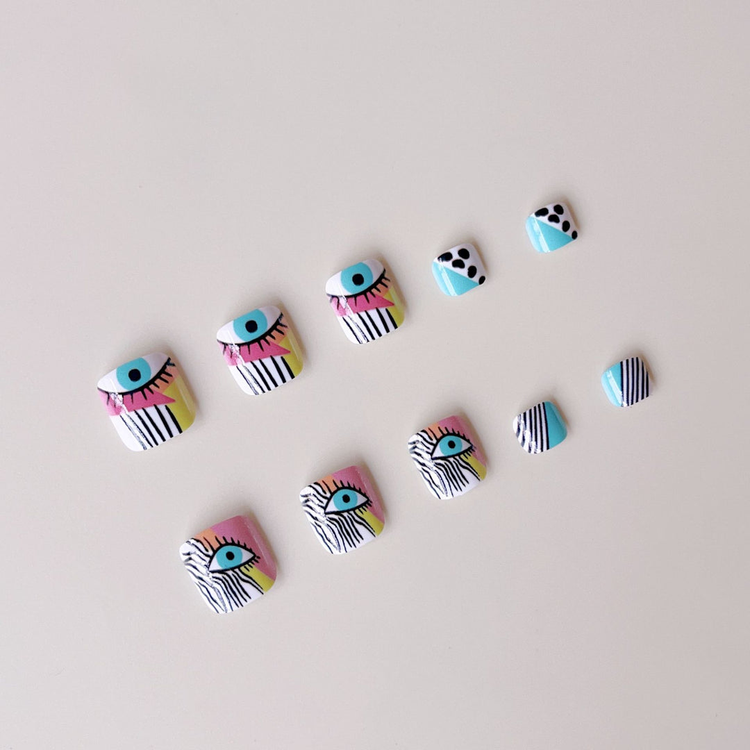 Artificial nail set with vibrant color accents and geometric patterns Bowlift
