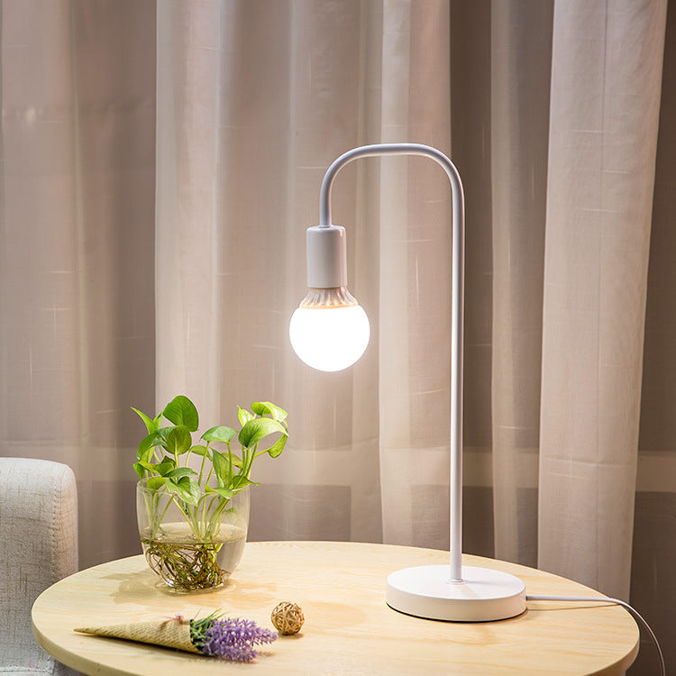 Minimalist Curved-Arm Table Lamp with Round Base and Standard Bulb Socket Bowlift