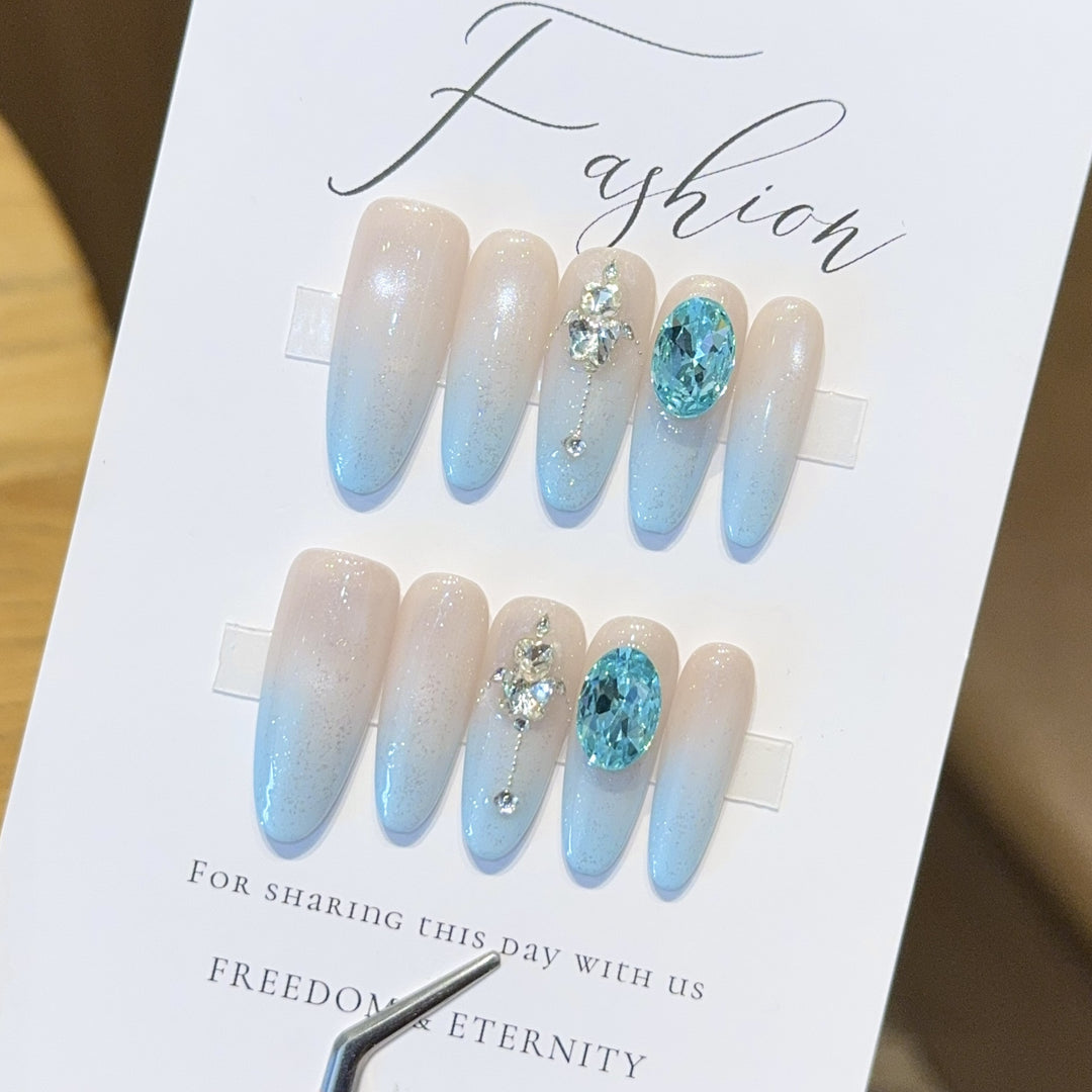 Glamorous artificial nails with sparkling rhinestone details Bowlift