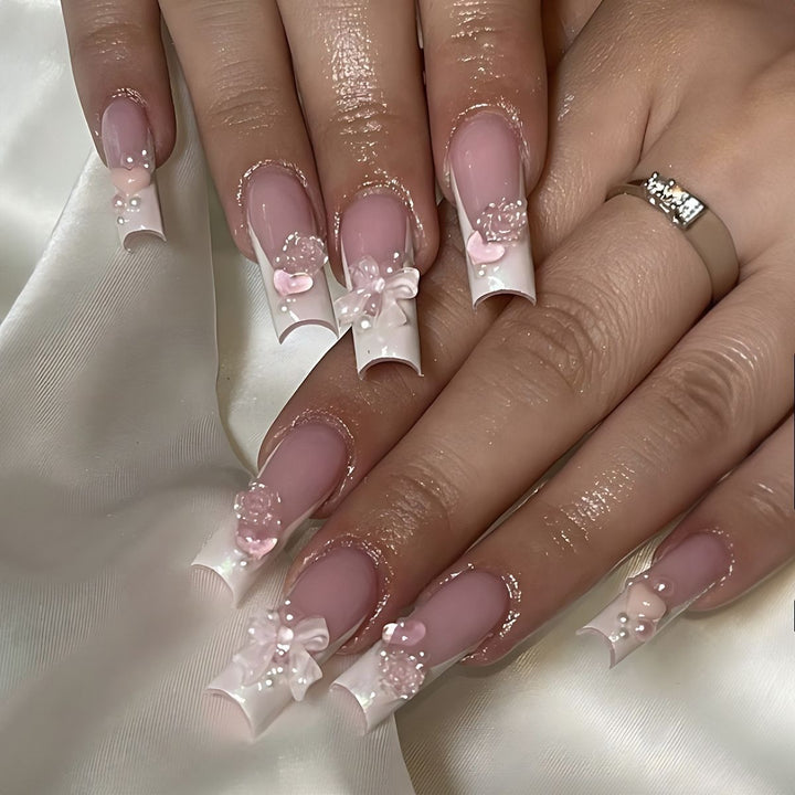 Creative acrylic nail set with delicate pearl and gloss accents Bowlift