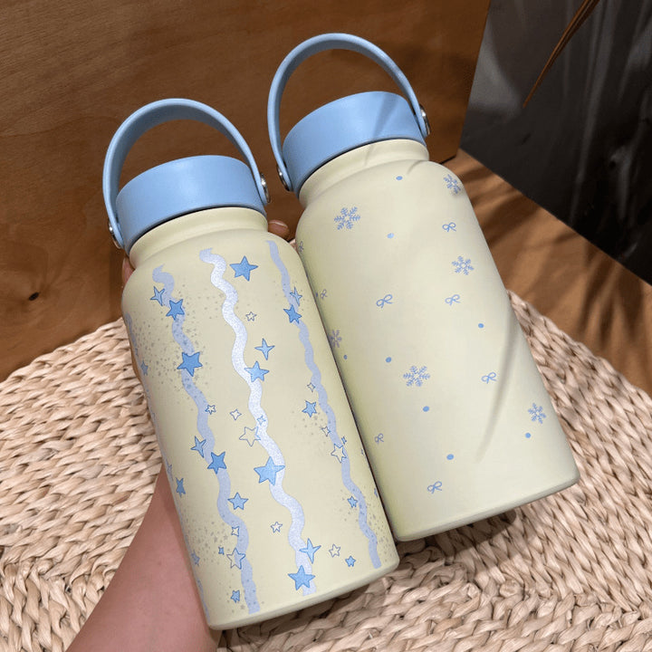 Women's insulated drinking bottle with practical carrying handle and cheerful design Bowlift