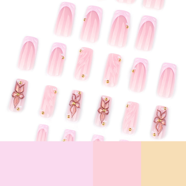 Artistic acrylic nails with flower design and glitter variations Bowlift