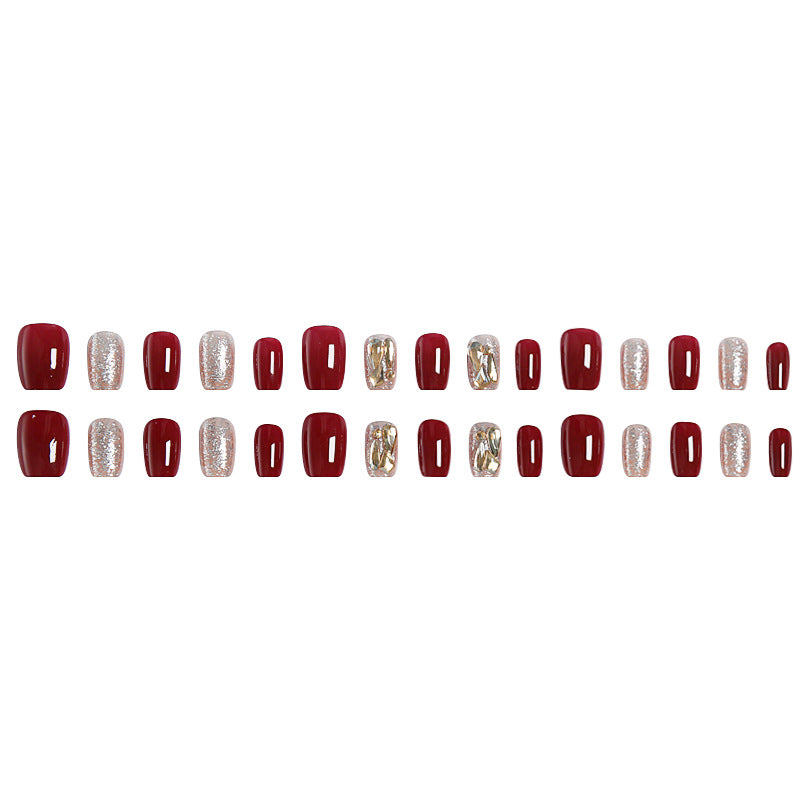 Artificial nail set with elegant glitter and metallic accents Bowlift