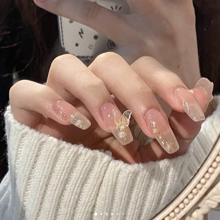 Artificial nails with elegant bows and pearl decorations Bowlift