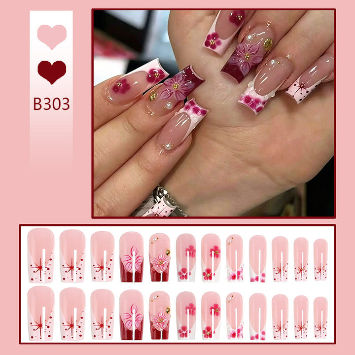 Artificial nail set with floral detail and glitter effects Bowlift