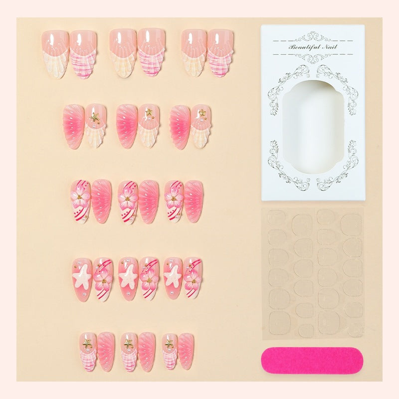 Artificial nail set with maritime shell and flower design Bowlift