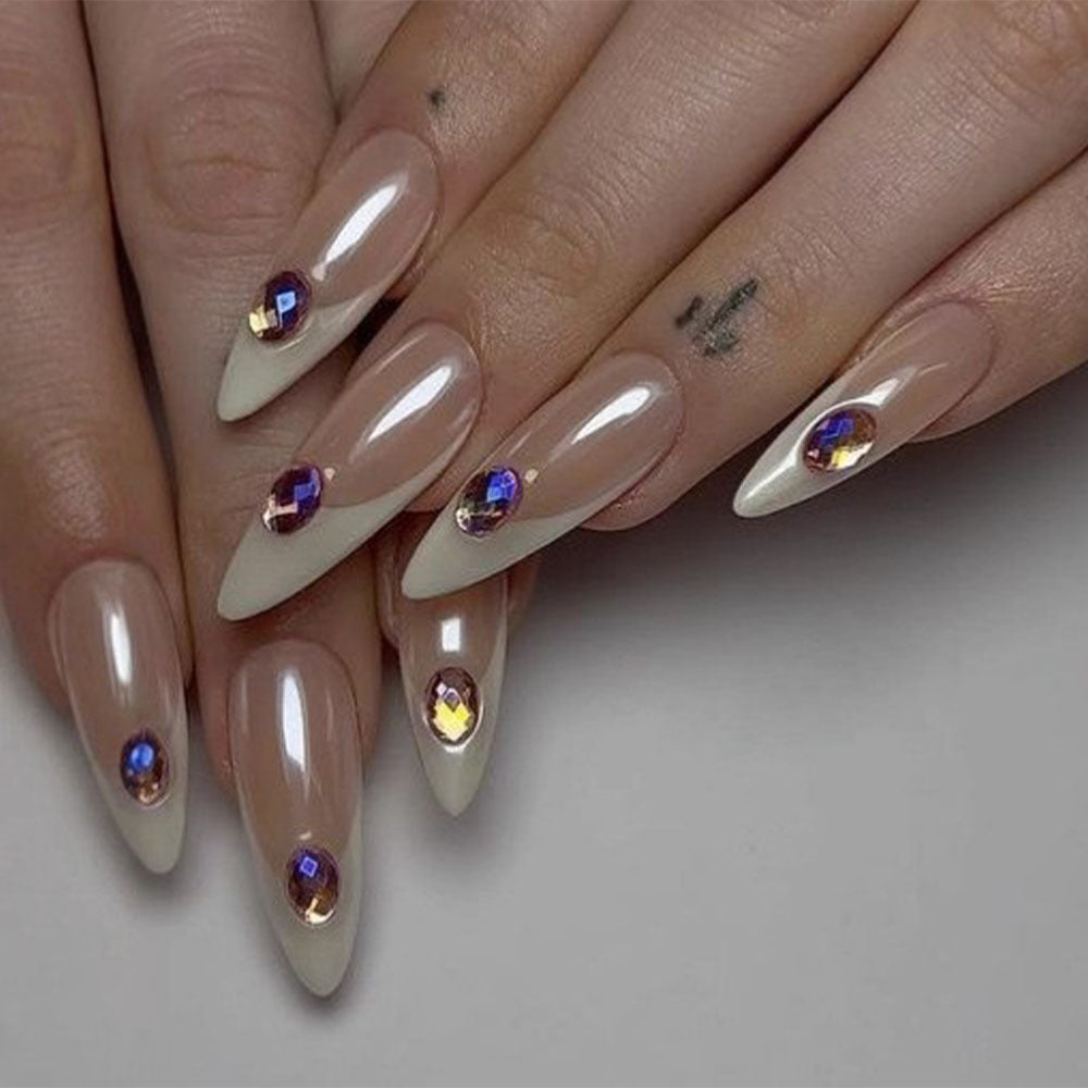 Artificial nails in modern stiletto design with glitter accents Bowlift