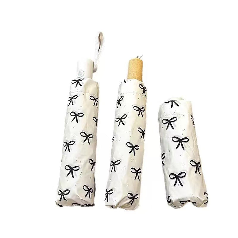 Women's foldable umbrella with elegant bow design Bowlift