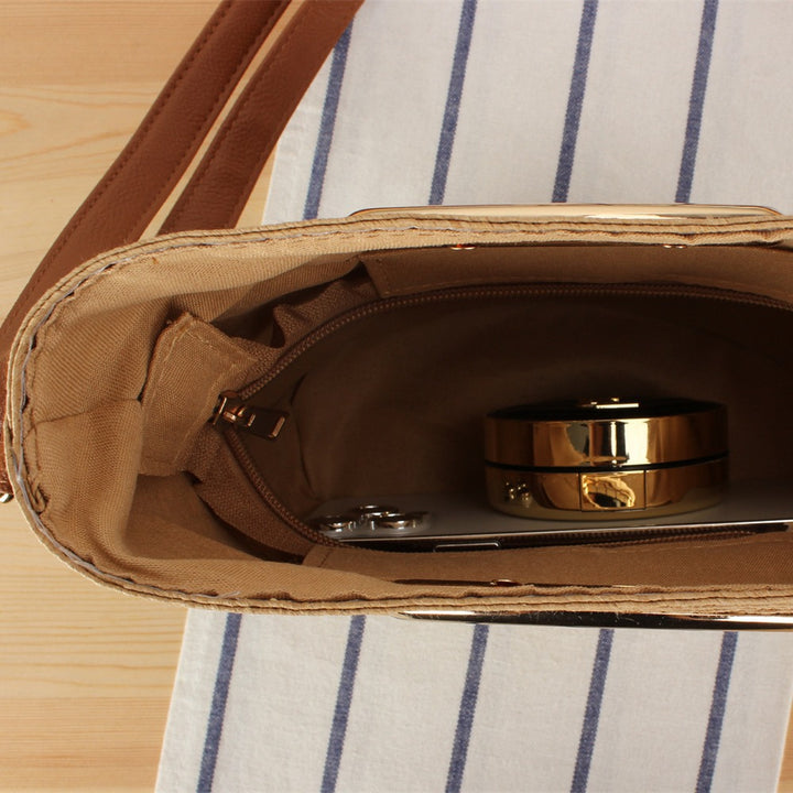 Shoulder bag made of hand-woven natural material with elegant ring closure Bowlift