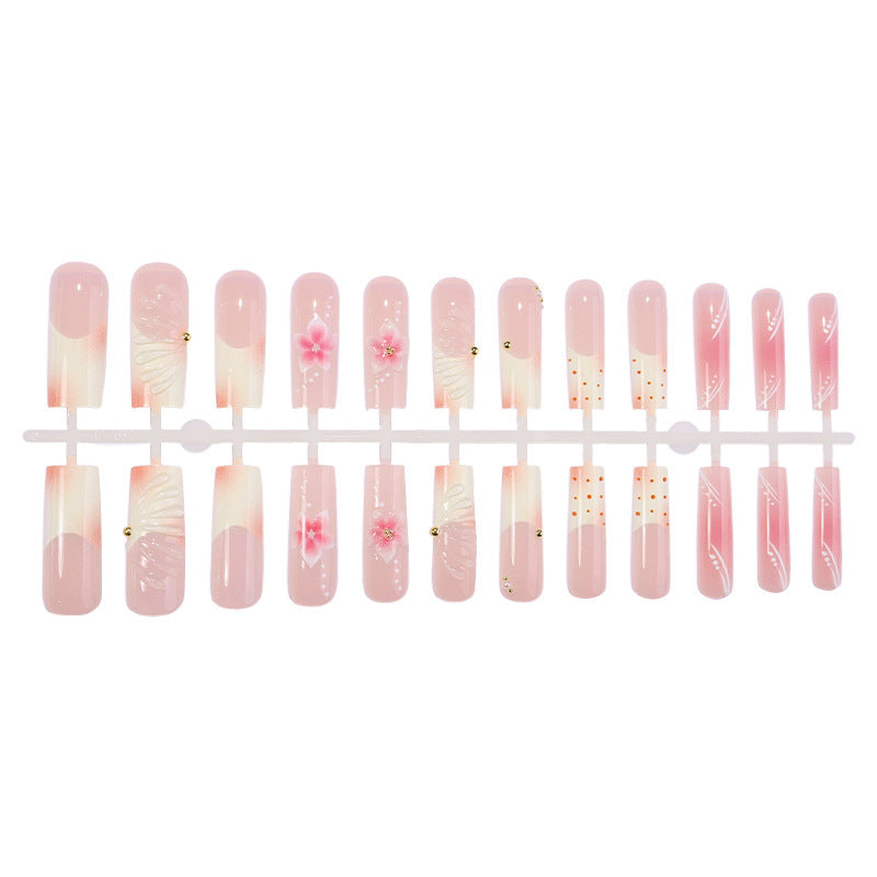 Artificial nail set with delicate flower and glitter accents Bowlift