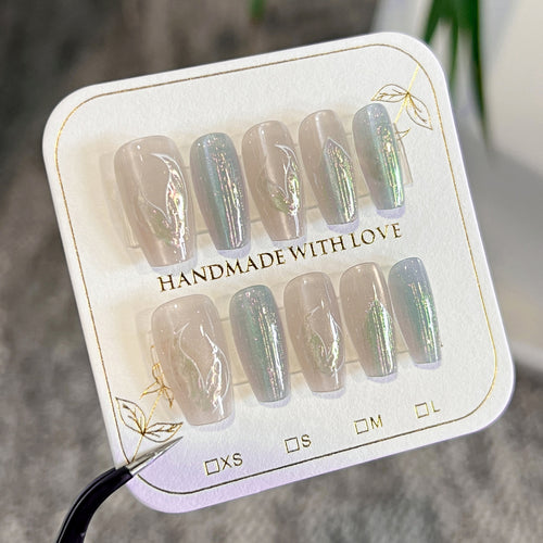 Artful artificial nails with transparent color gradient and delicate floral designs Bowlift